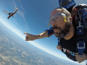 A close-up of a man skydiving.