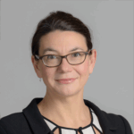 Chrissie Thirlwell smiles at camera.